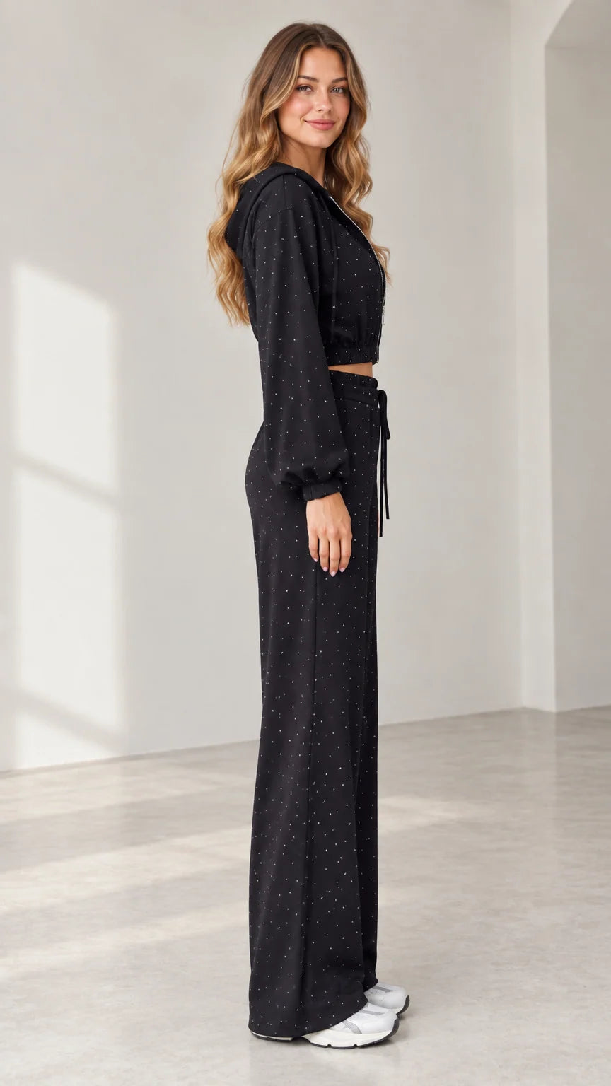 Side profile view of model wearing black sparkle 3-piece lounge set
