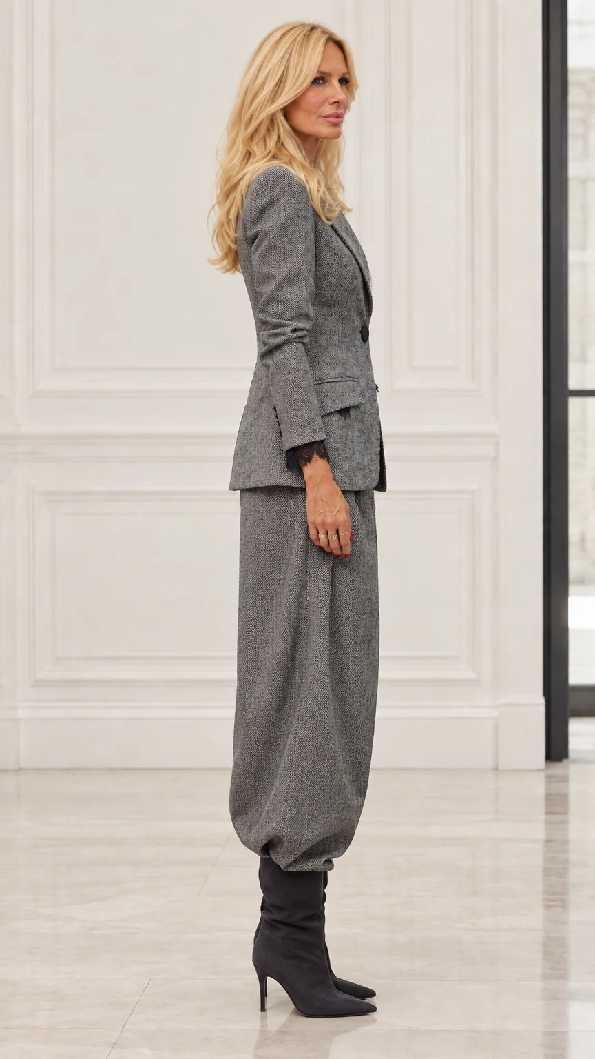 Side profile of model in Grey tailored blazer and relaxed balloon pants set