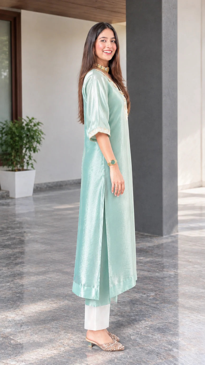 Side profile view showing side slit and drape of sage green silk blend tunic kurta