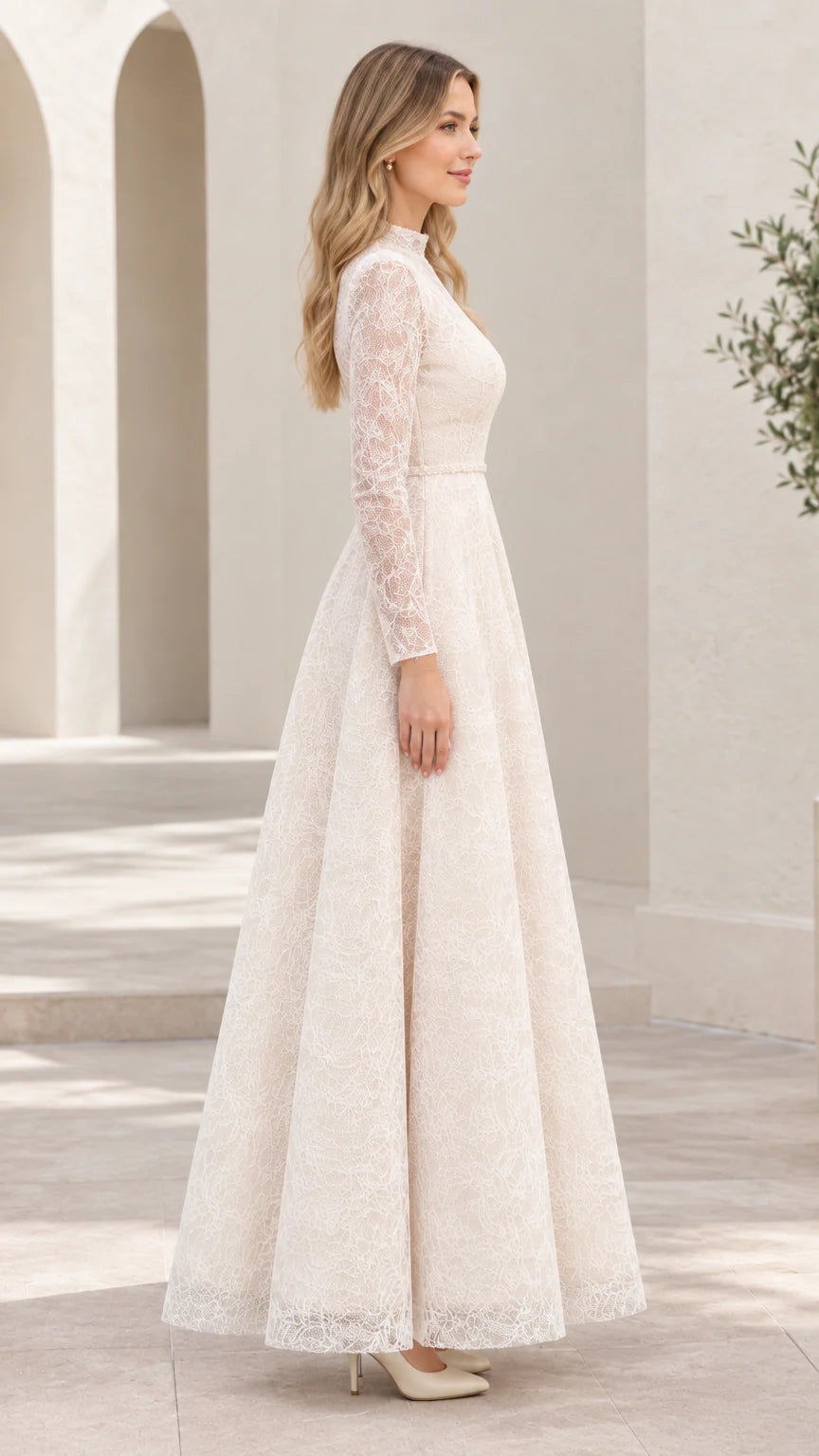 Side profile of woman in long sleeve ivory lace A-line evening gown