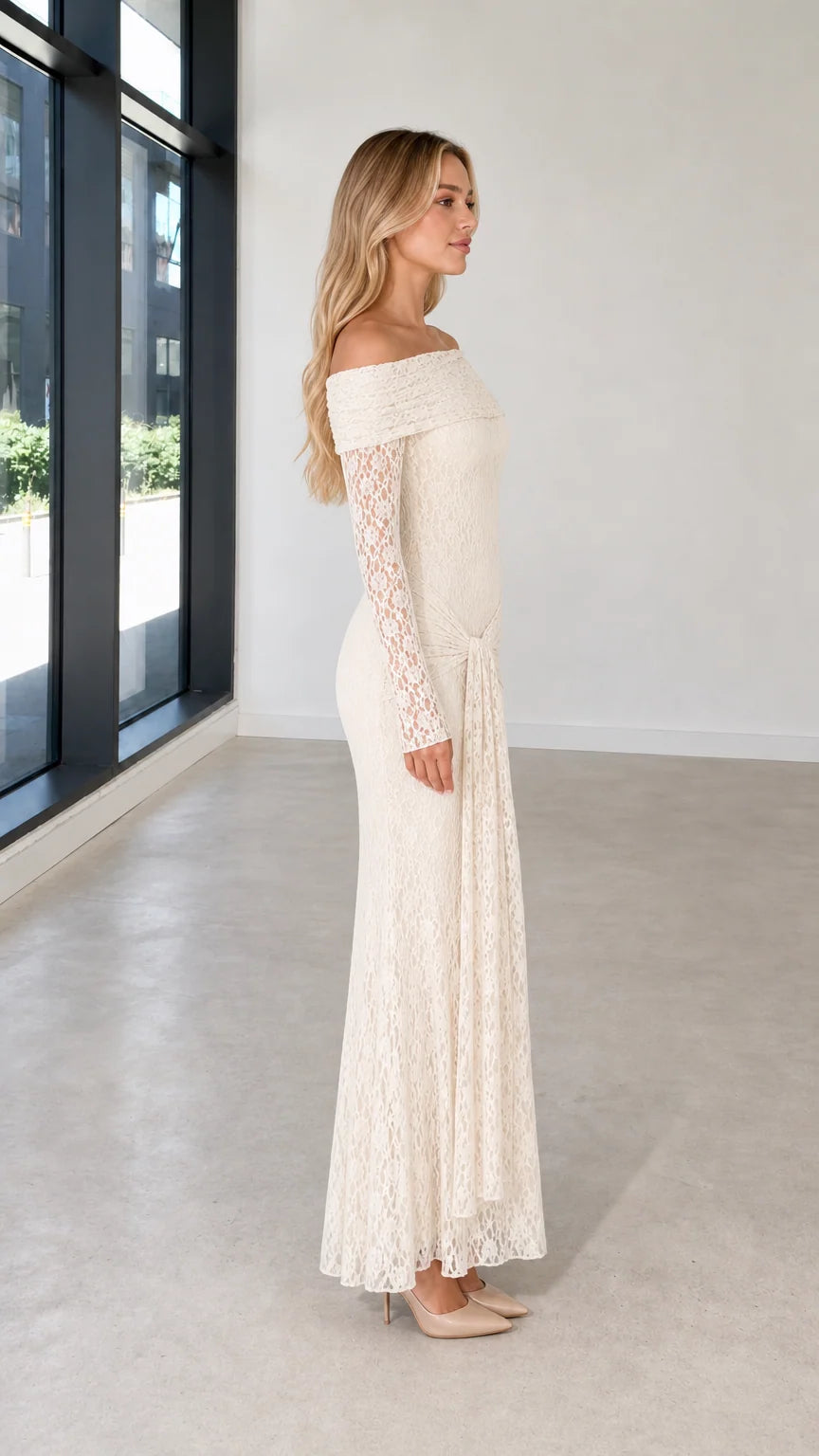 Side profile view of ivory lace evening dress