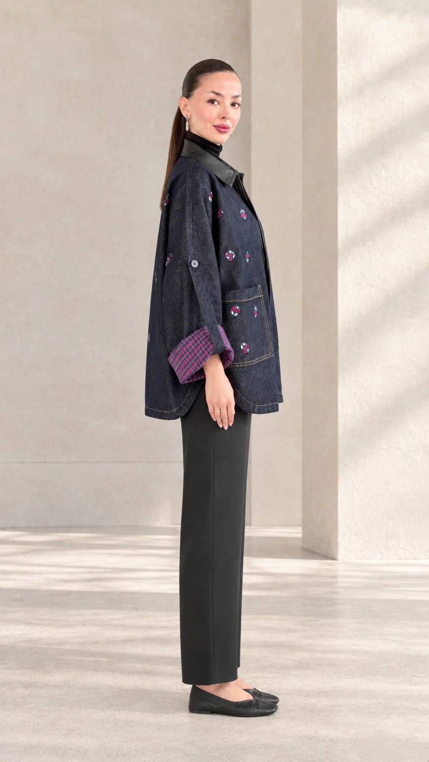 Side profile view of woman modeling Indigo Blue embroidered jacket with relaxed sleeves