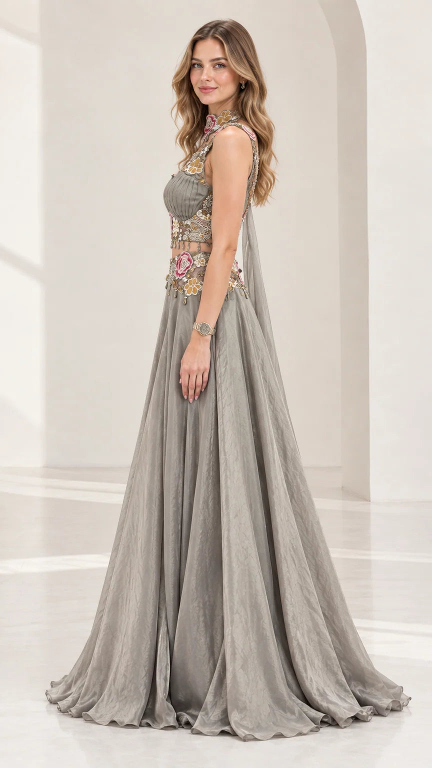 Side profile of silver grey two-piece formal dress with capelet drape
