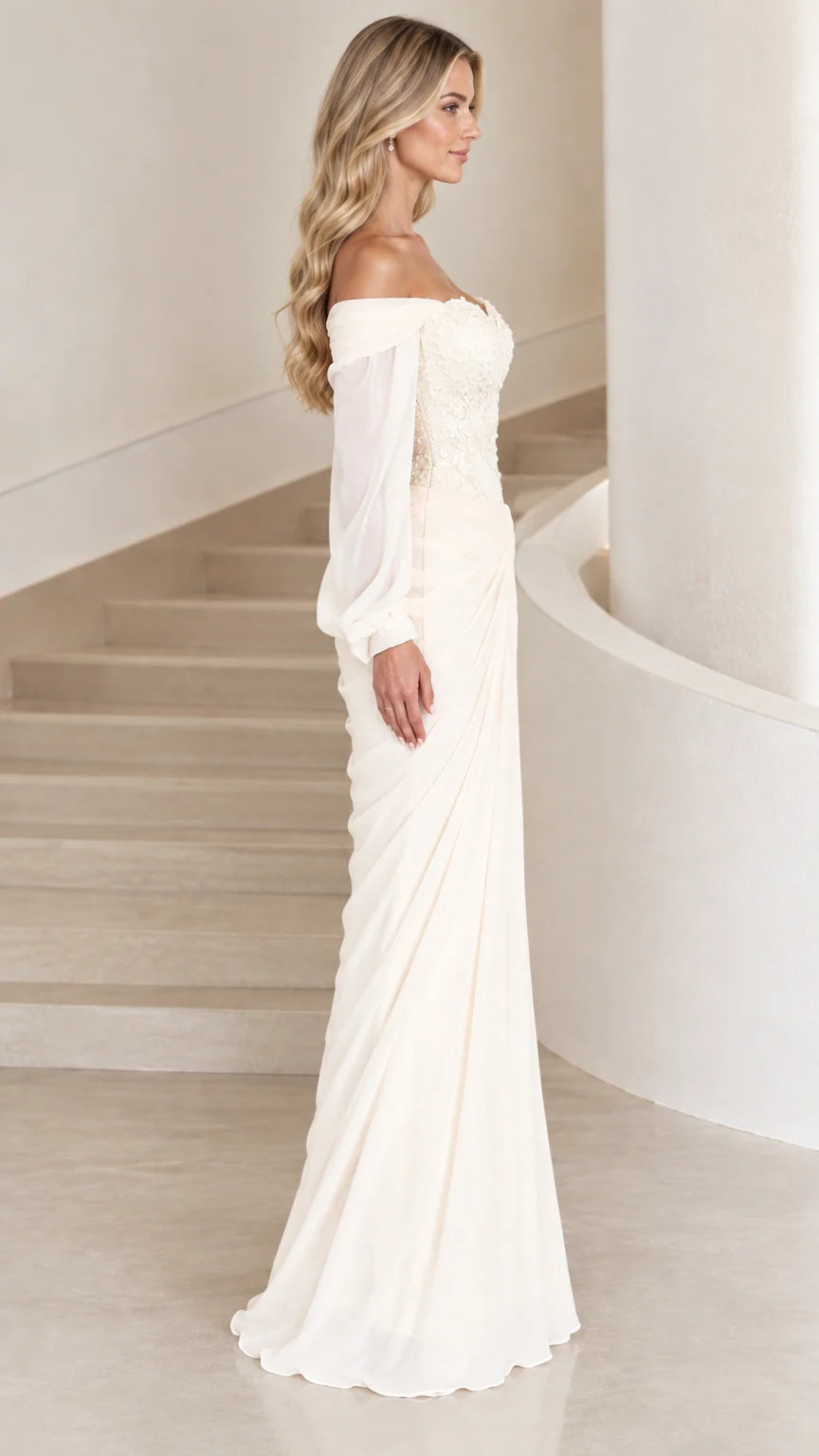 Side profile view of ivory off-the-shoulder chiffon formal dress