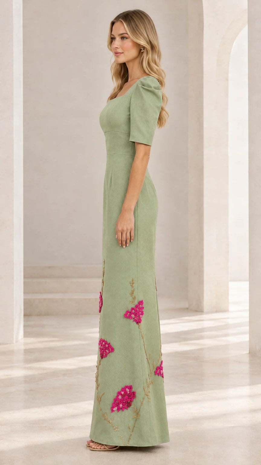 Side profile view of woman wearing sage green puff sleeve formal evening gown