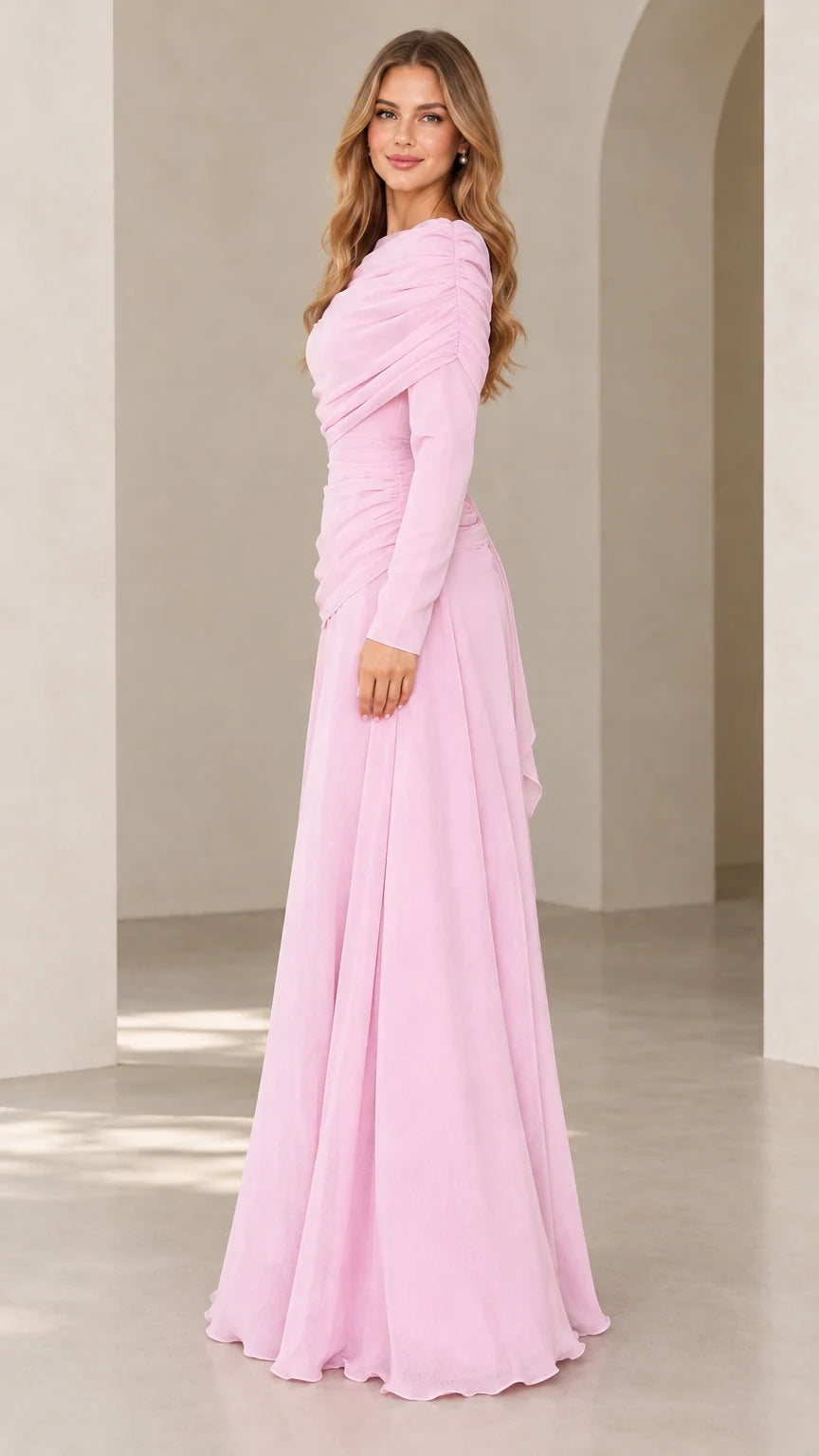 Side angle view of model wearing light pink ruched maxi formal dress