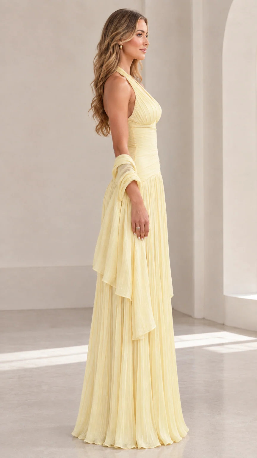 Side profile of Butter Yellow pleated halter formal gown with matching wrap