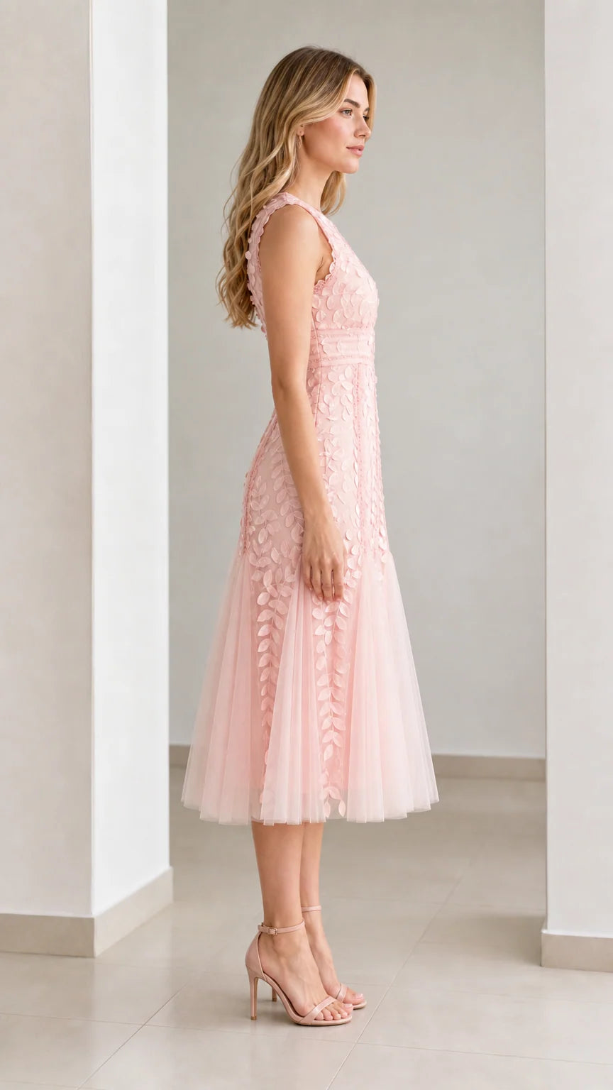 Side profile view of pink midi dress