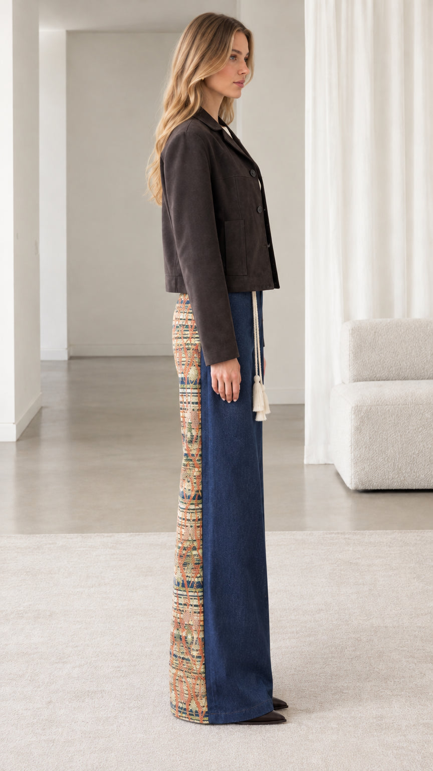 Side profile view of model wearing espresso brown cropped jacket