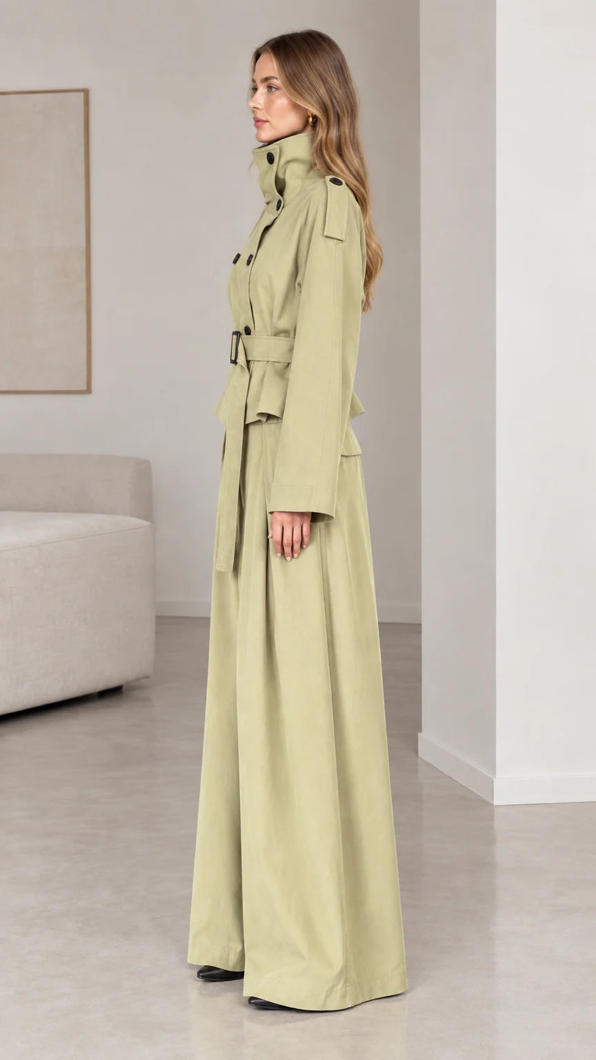 Side profile of woman in sage green high-neck belted two-piece pant set
