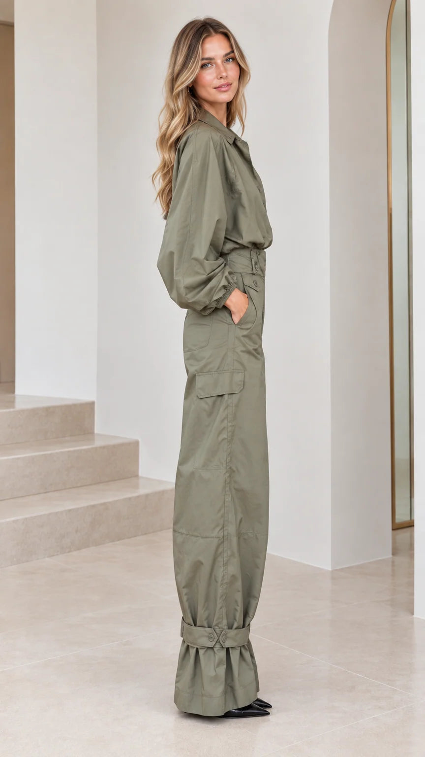 Side profile view of woman modeling the olive green wide-leg cargo jumpsuit