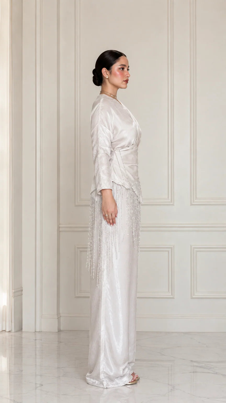 Side full view of model wearing Champagne satin two-piece set