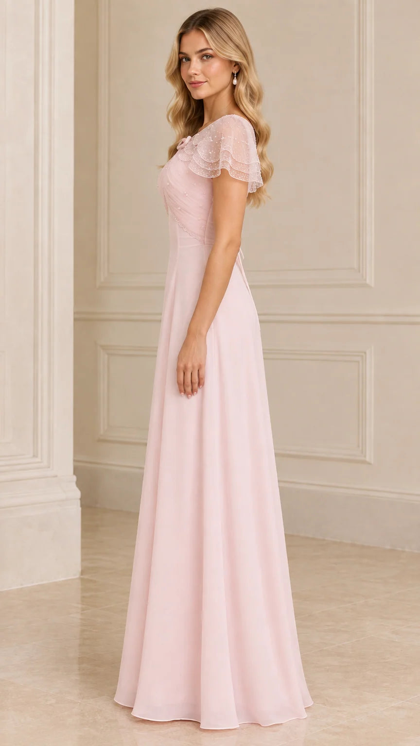 Side profile view of blush pink formal capelet maxi dress
