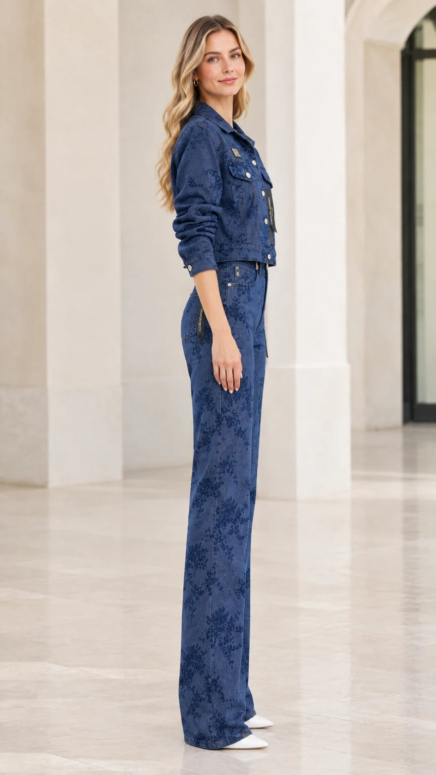 Side profile view of denim blue floral embossed matching jacket and trousers set