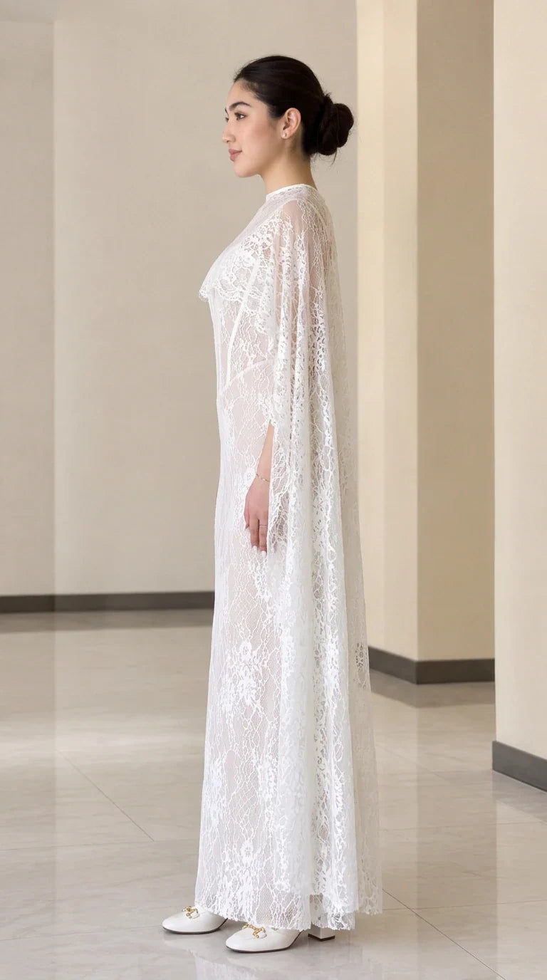 White lace evening gown with cape overlay, side profile view