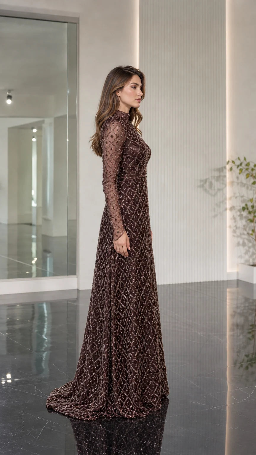 Side profile of model wearing chocolate brown beaded floor length formal gown