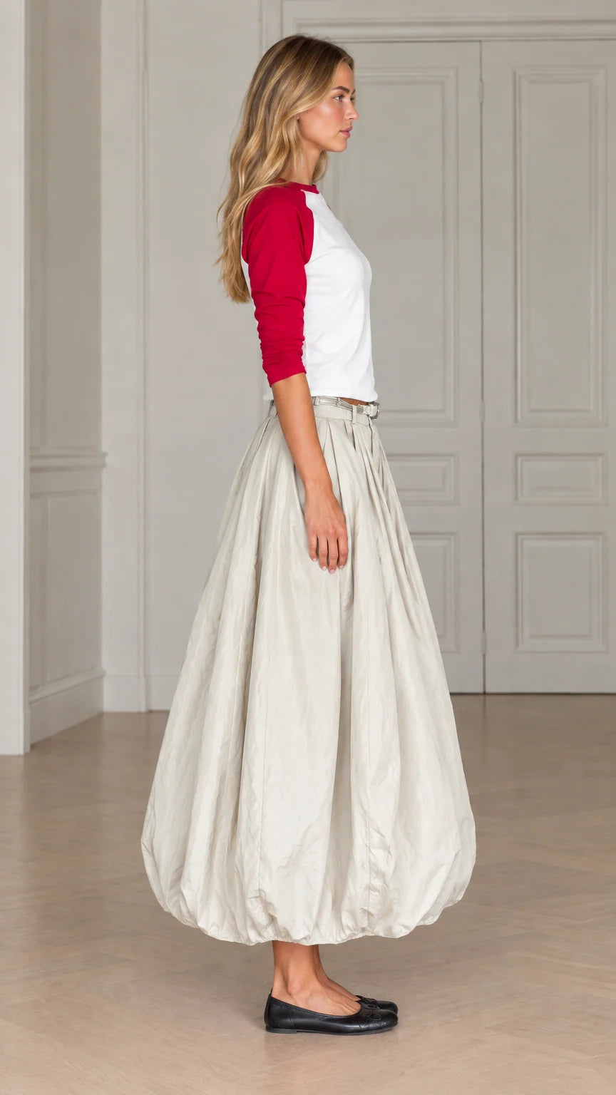 Side profile view of women's balloon maxi skirt and raglan sleeve top in red and cream