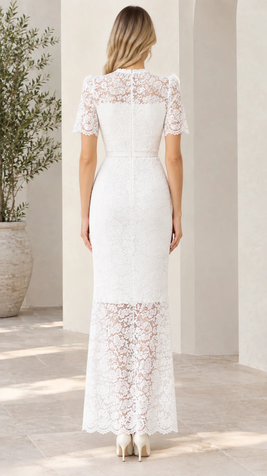 Back view of woman wearing white short sleeve lace maxi dress