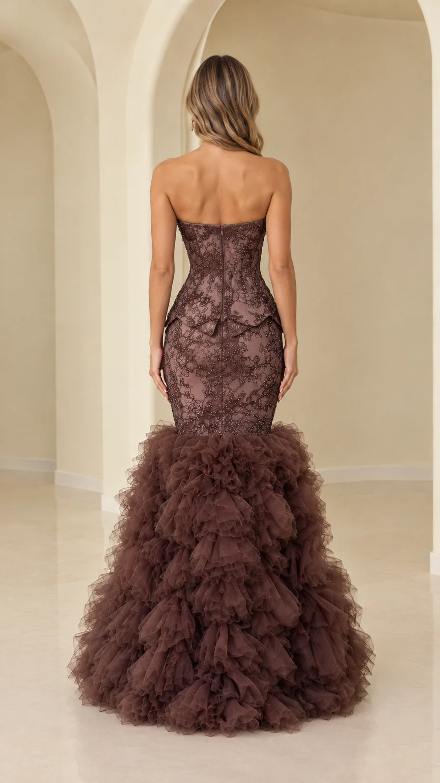 Back view of model wearing chocolate brown strapless corset mermaid gown
