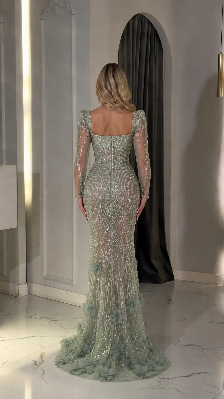 Back view of sage green long-sleeve evening gown showcasing fitted silhouette and sweep train