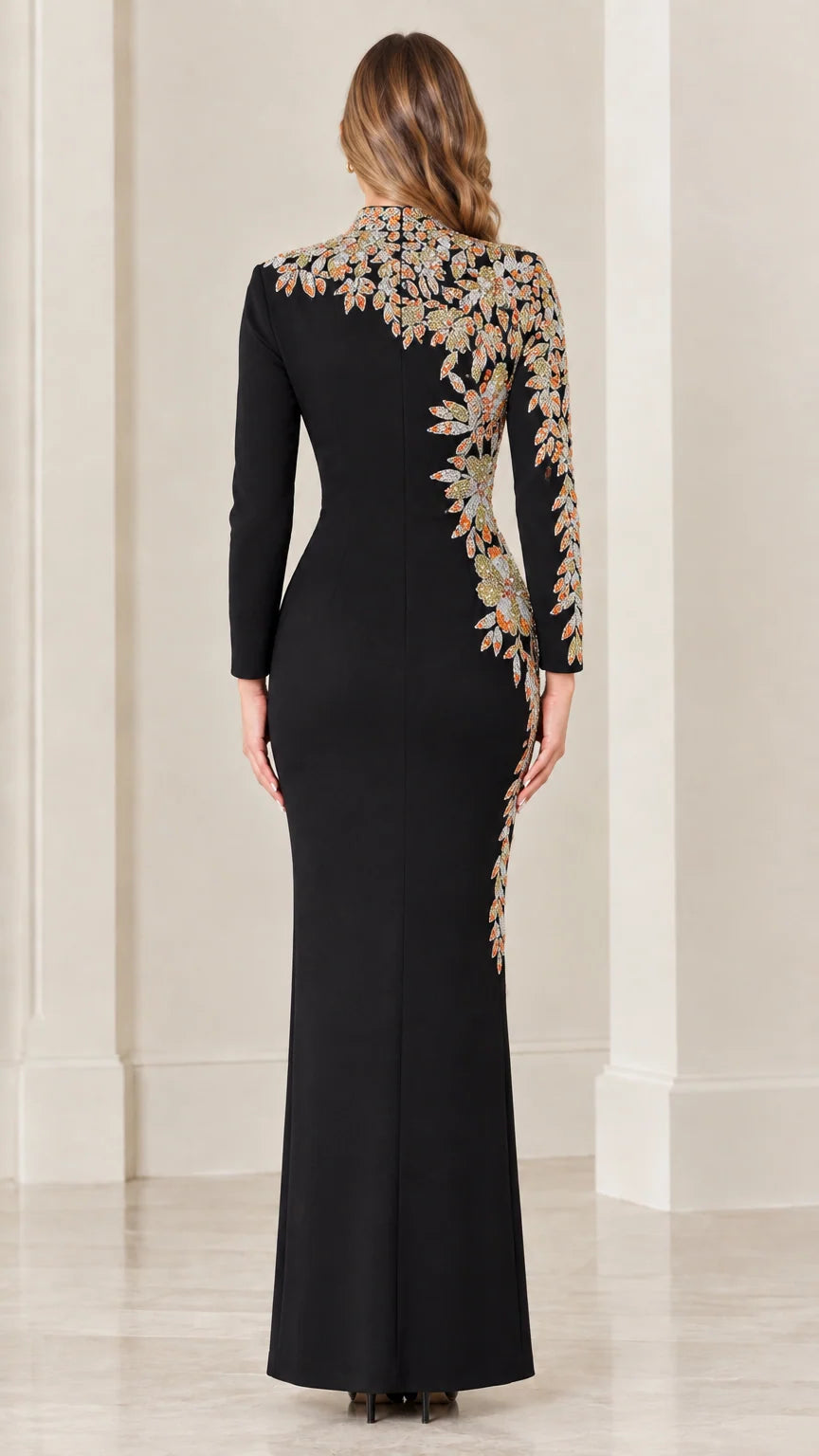 Back view of black long sleeve maxi gown highlighting shoulder embroidery