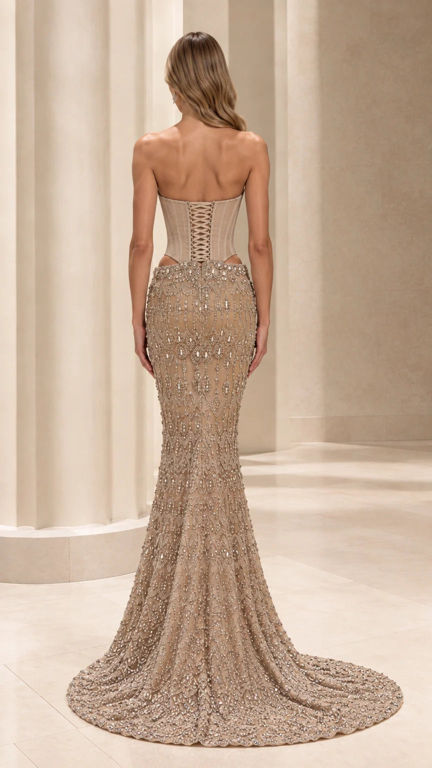 Back view of champagne formal mermaid gown showing lace-up corset closure and sweeping train