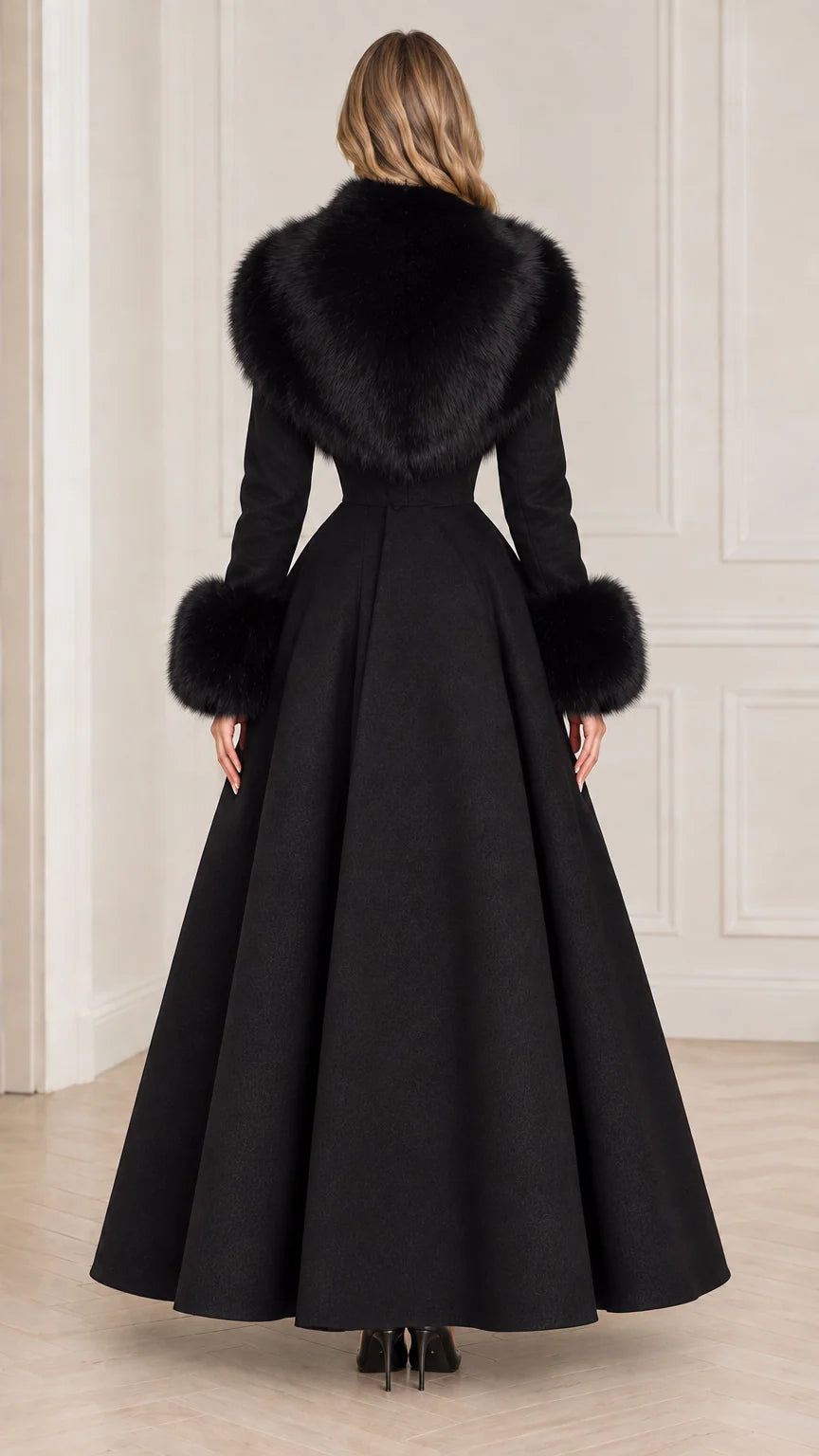 Back view of black longline maxi coat showing sweeping skirt silhouette