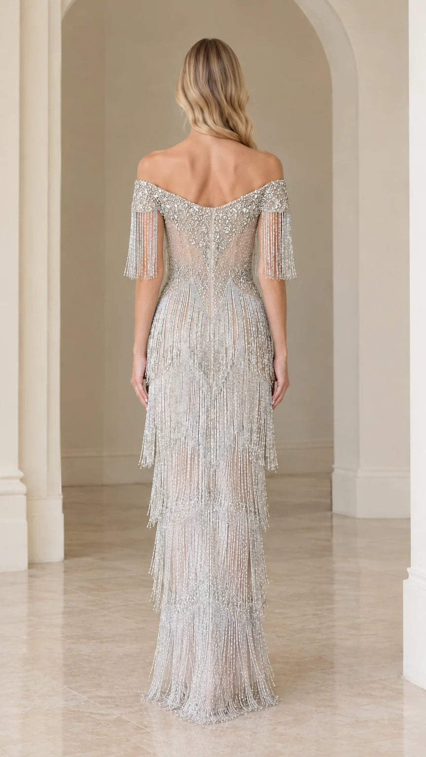 Back view of woman wearing silver beaded fringe maxi gown