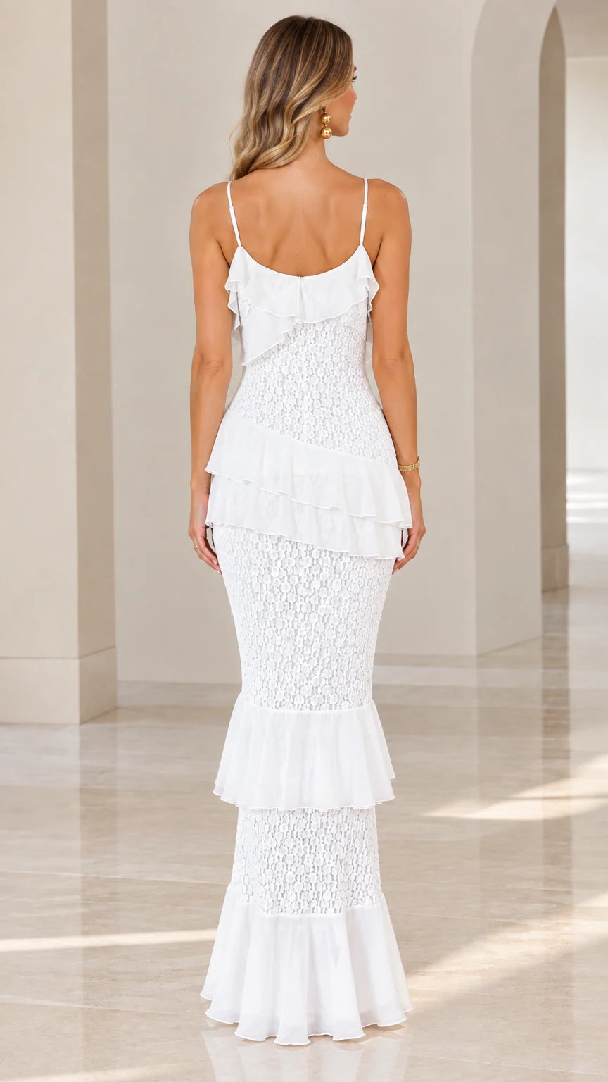 Back view of model wearing white tiered ruffle lace maxi dress