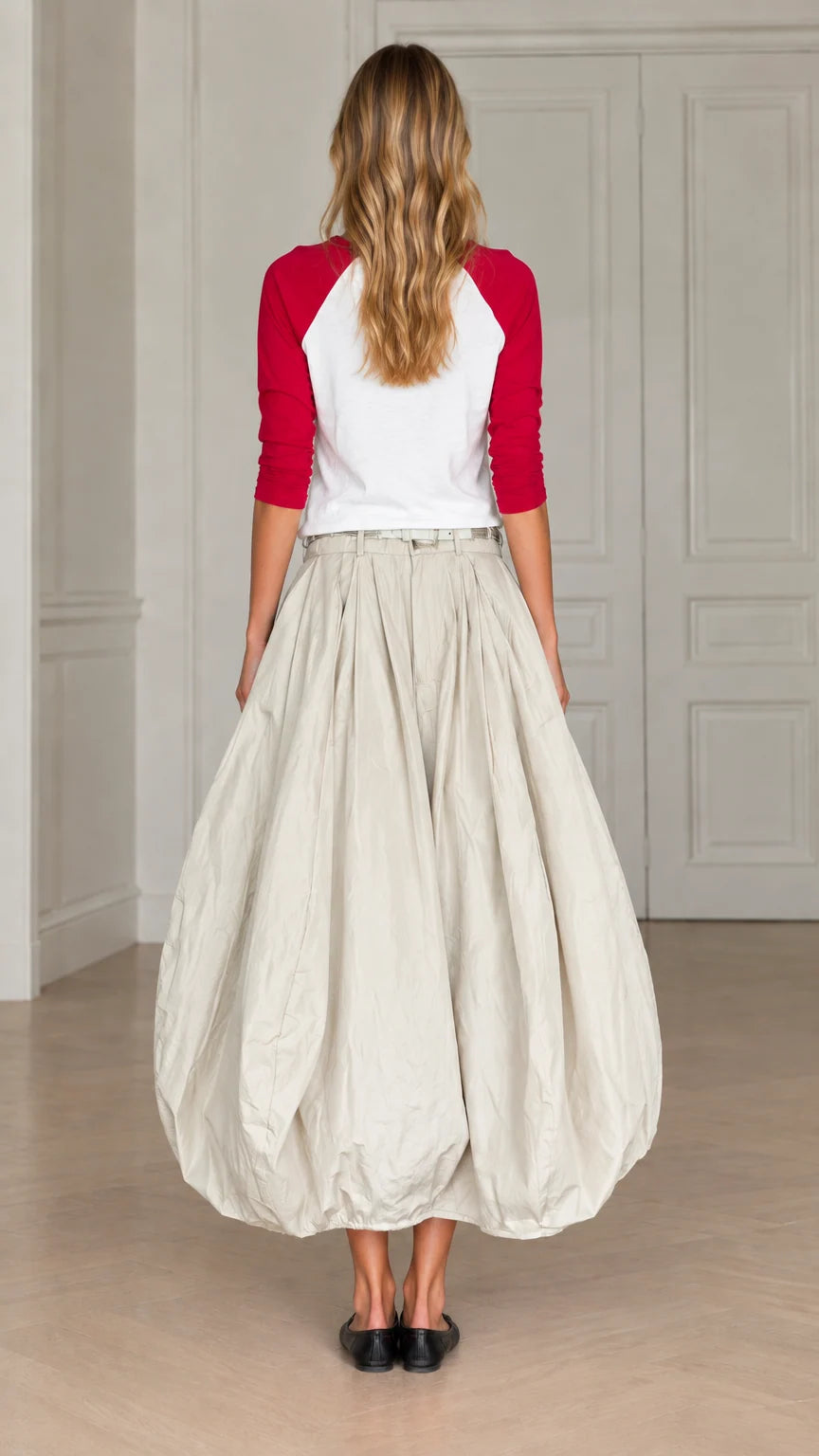 Back view of model wearing cream bubble maxi skirt with red and white raglan top