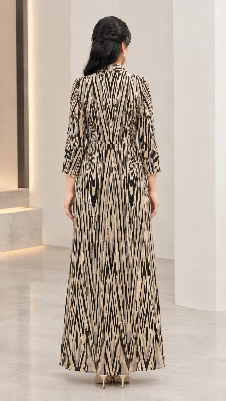 Back view of champagne gold A-line printed maxi dress