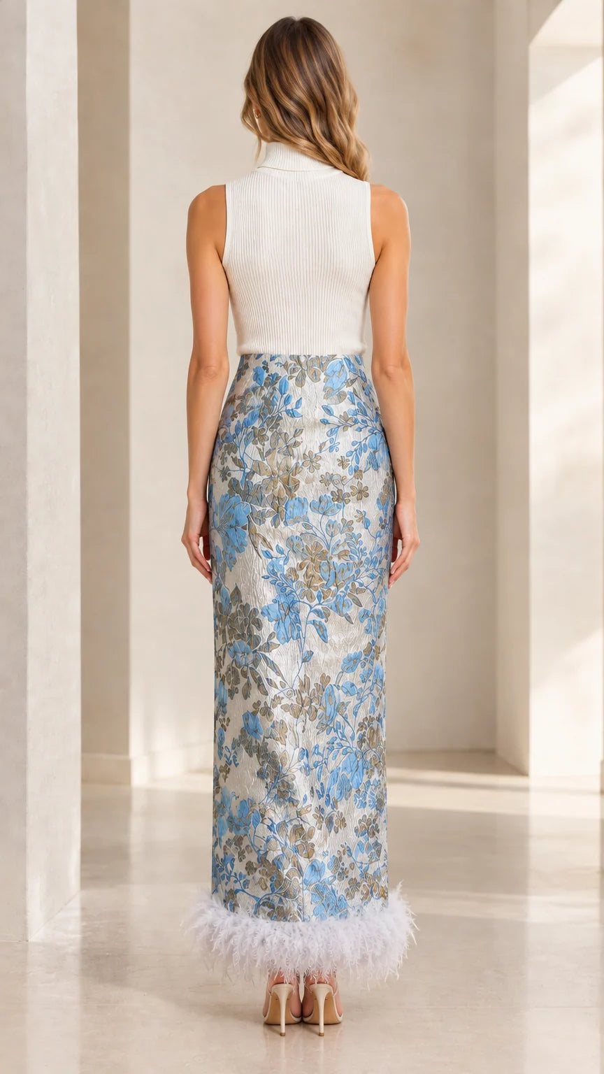 Back view of model showcasing the Light Blue jacquard maxi dress with feather hem