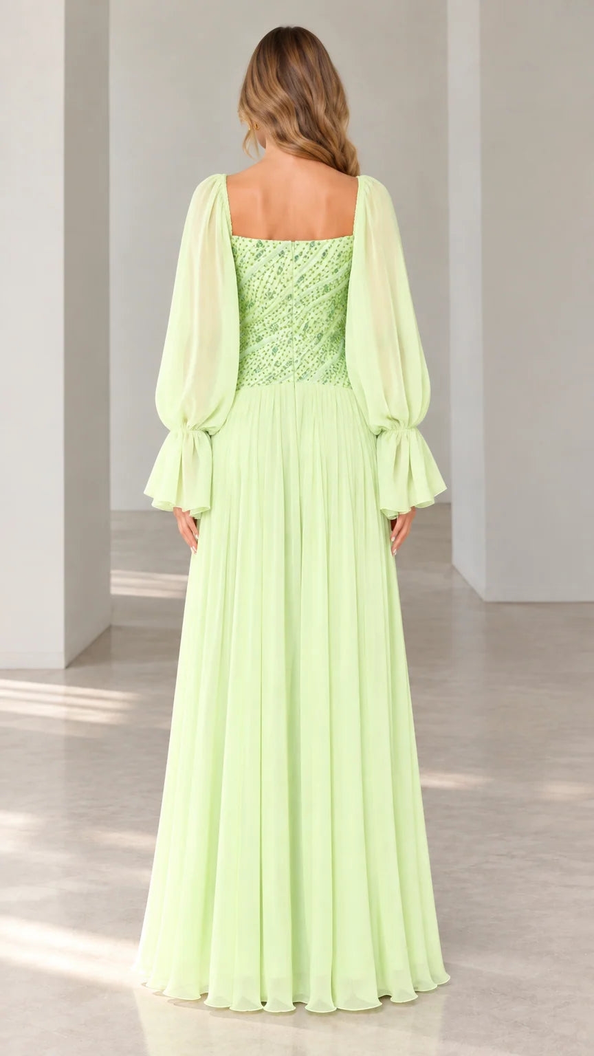 Back view of mint green square neck formal gown showing flowing pleated skirt