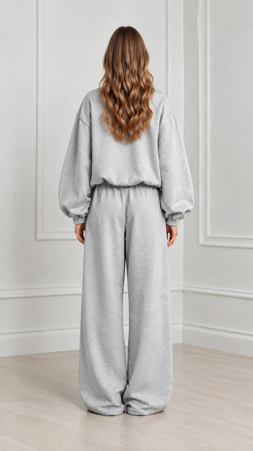 Back view of women's heather grey zip-up sweatshirt and wide leg loungewear set