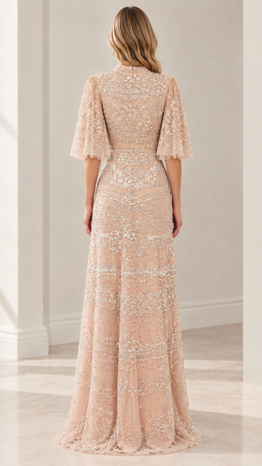 Back view of champagne embellished formal evening gown