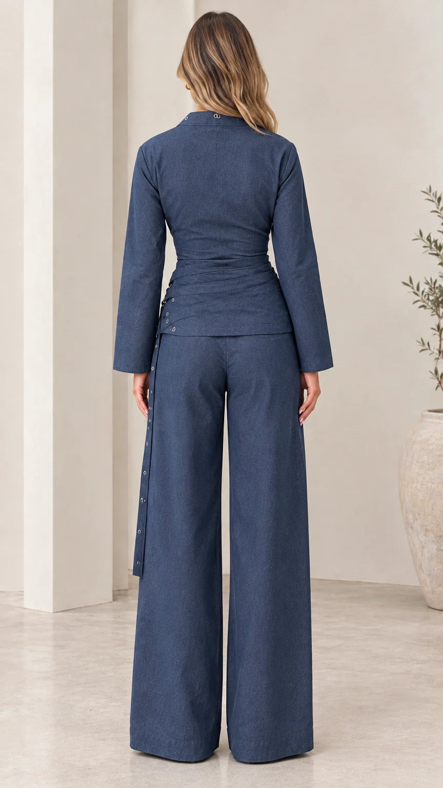 Model wearing Navy Blue open bolero and high-waisted wide leg pants - back view