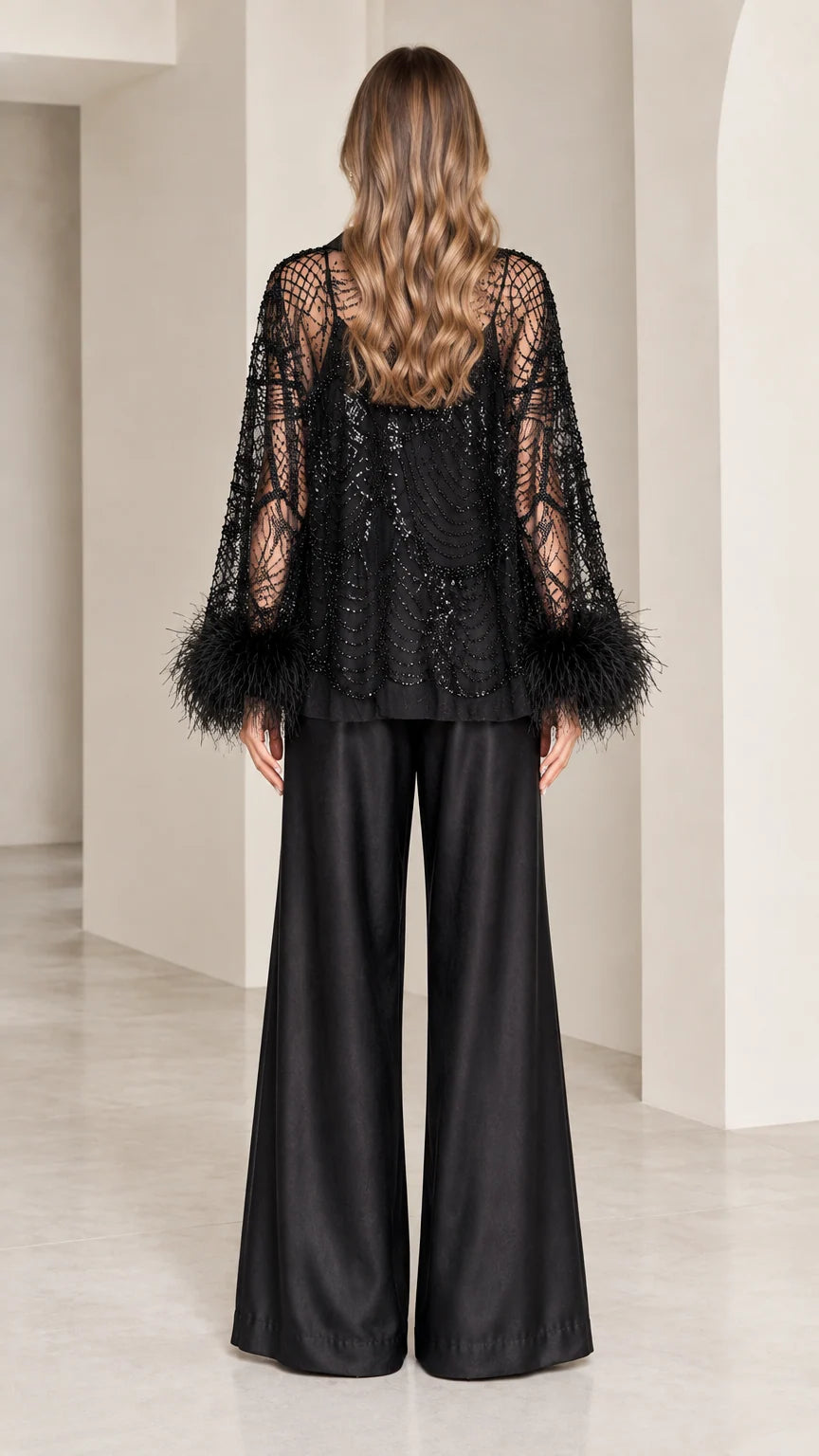 Back view of black sequined evening top and wide-leg pants
