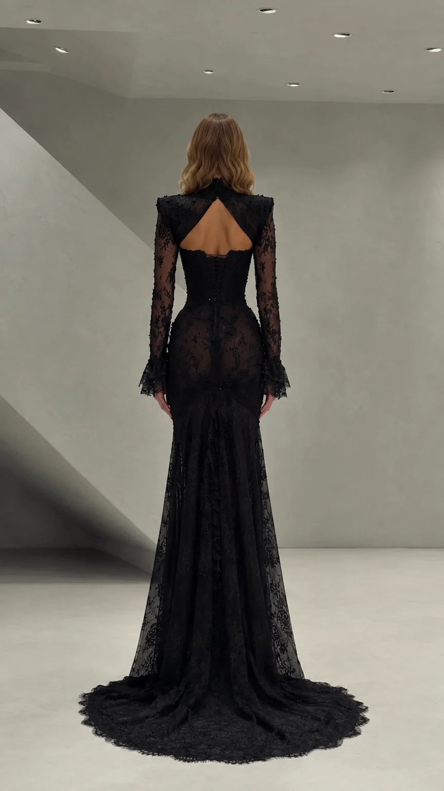 Back view of black lace evening gown showing cutout open back and train