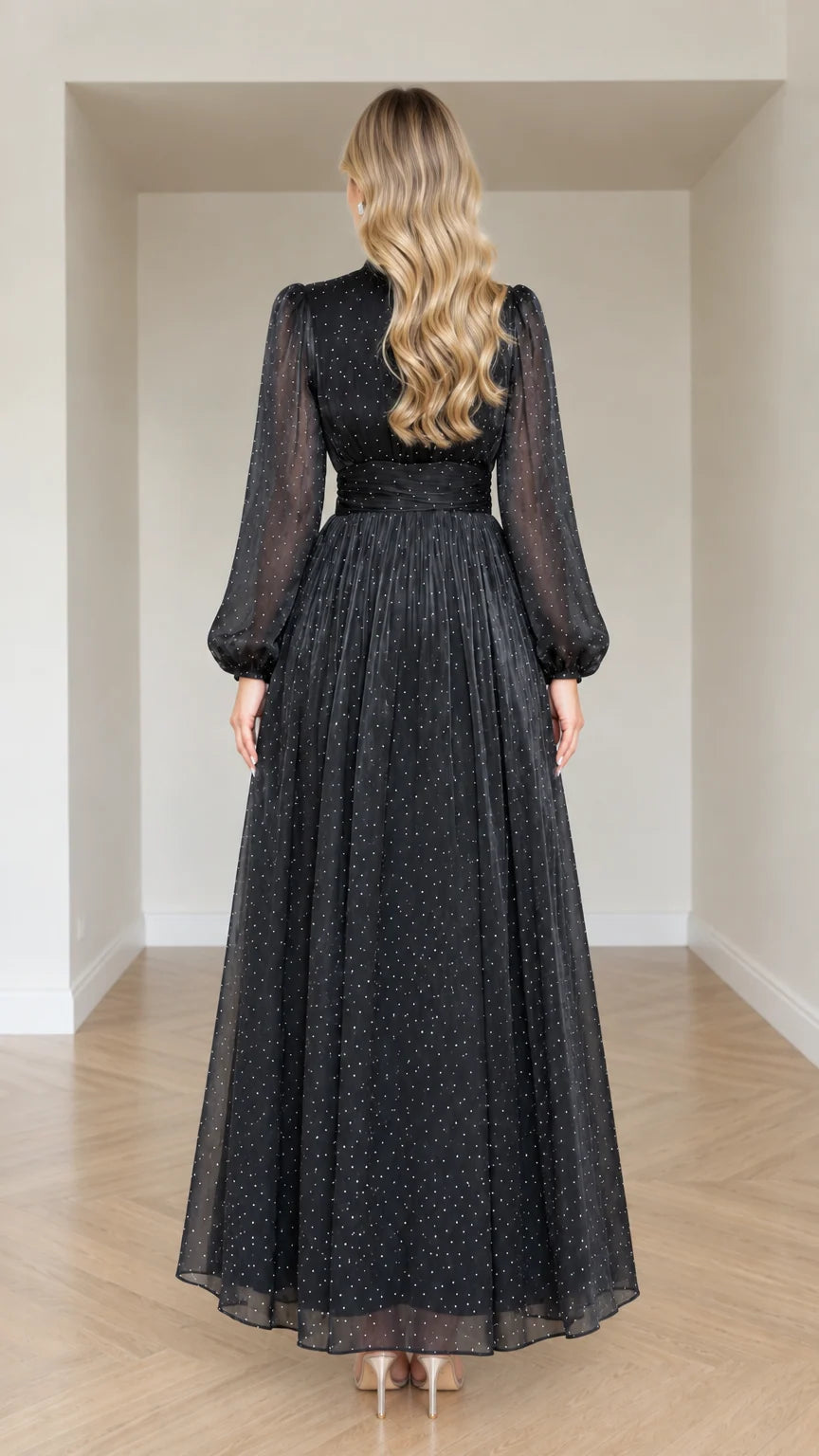 Back full-length view of woman in Black pleated high neck long evening gown