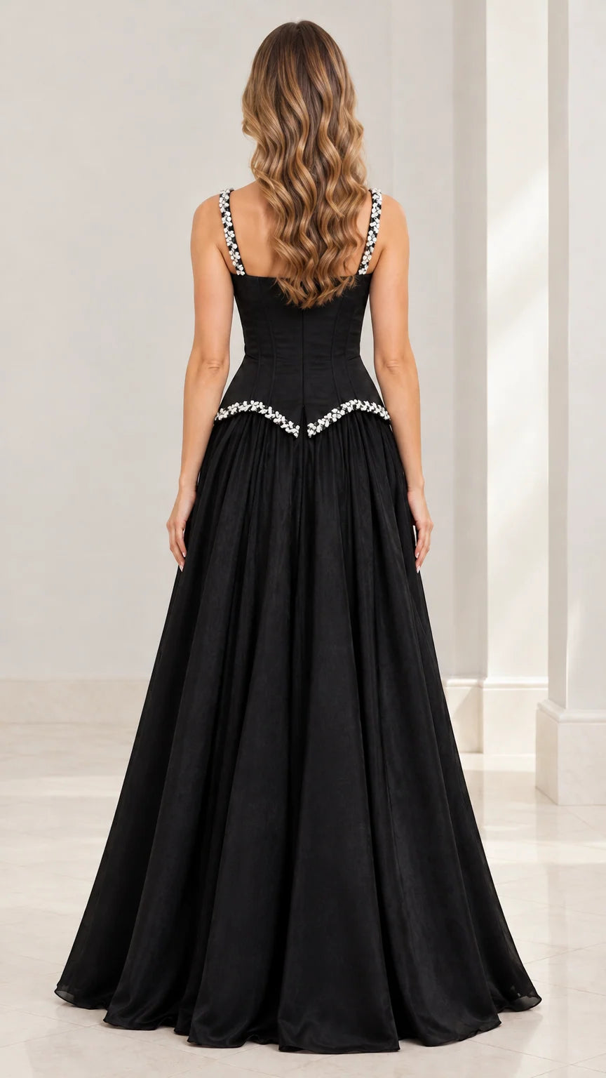 Back view of the black formal maxi gown highlighting the square back and zipper