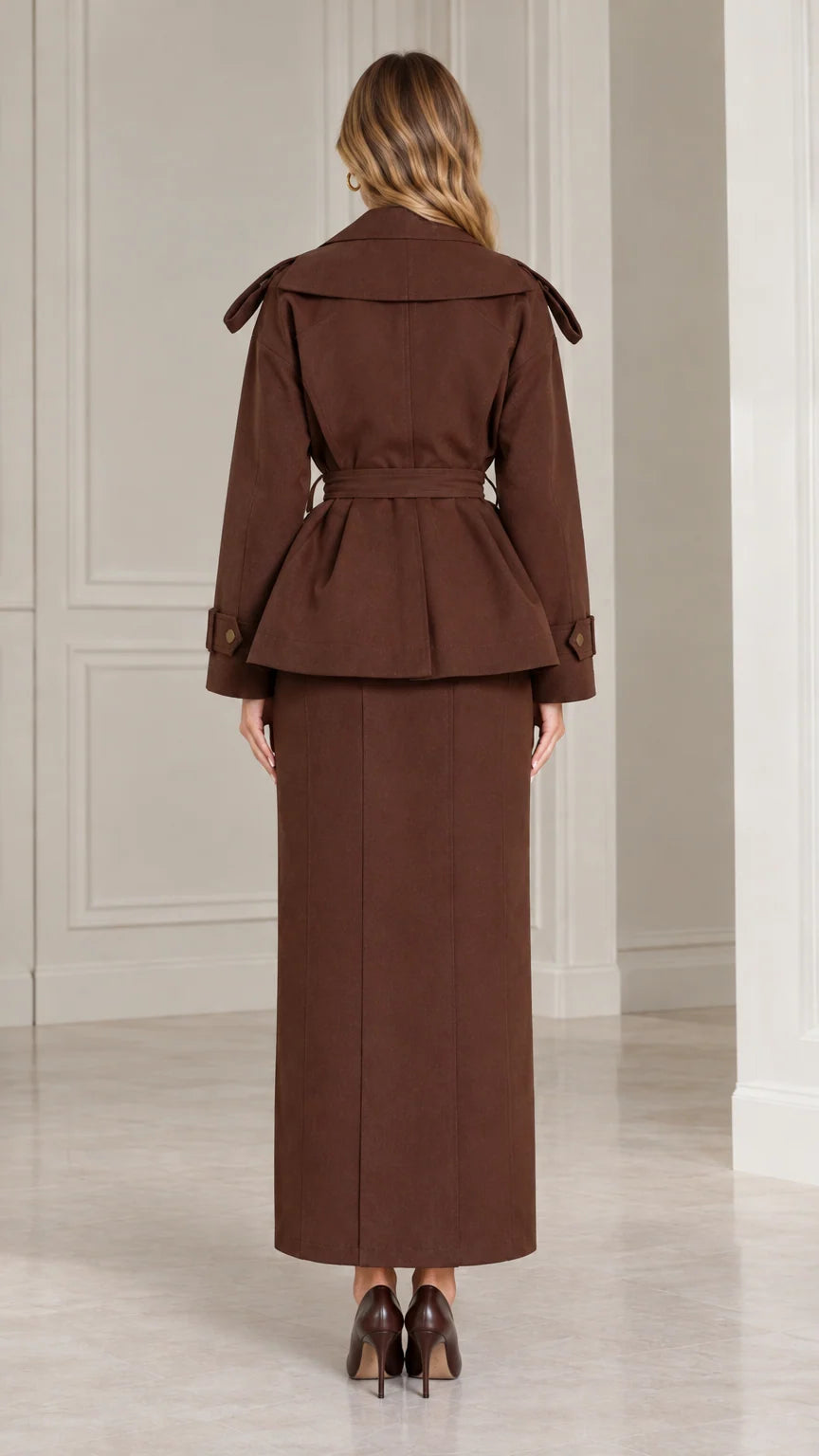 Back view of chocolate brown belted jacket and long skirt suit