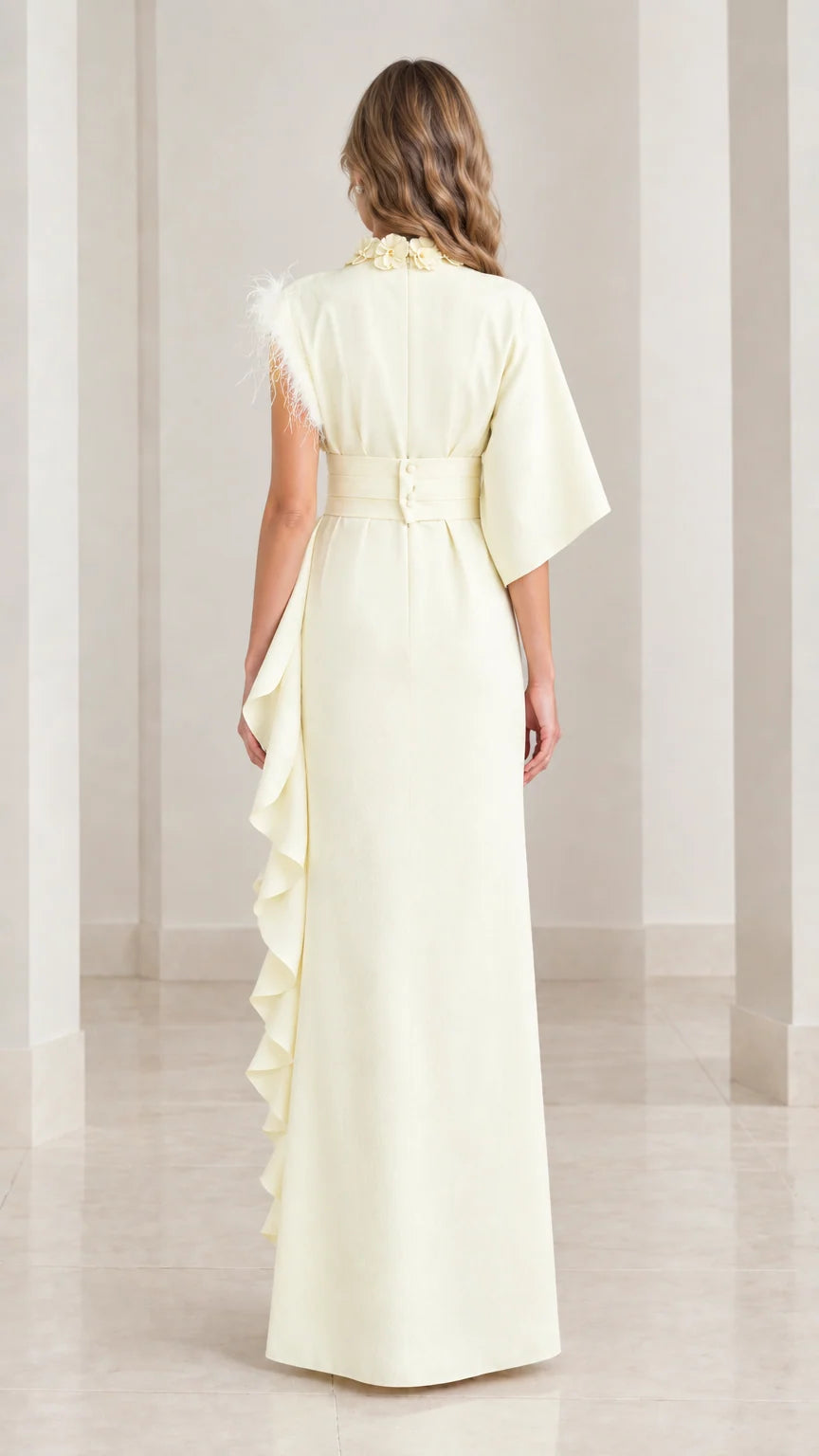 Back view of butter yellow maxi dress showing wide waistband and button closure
