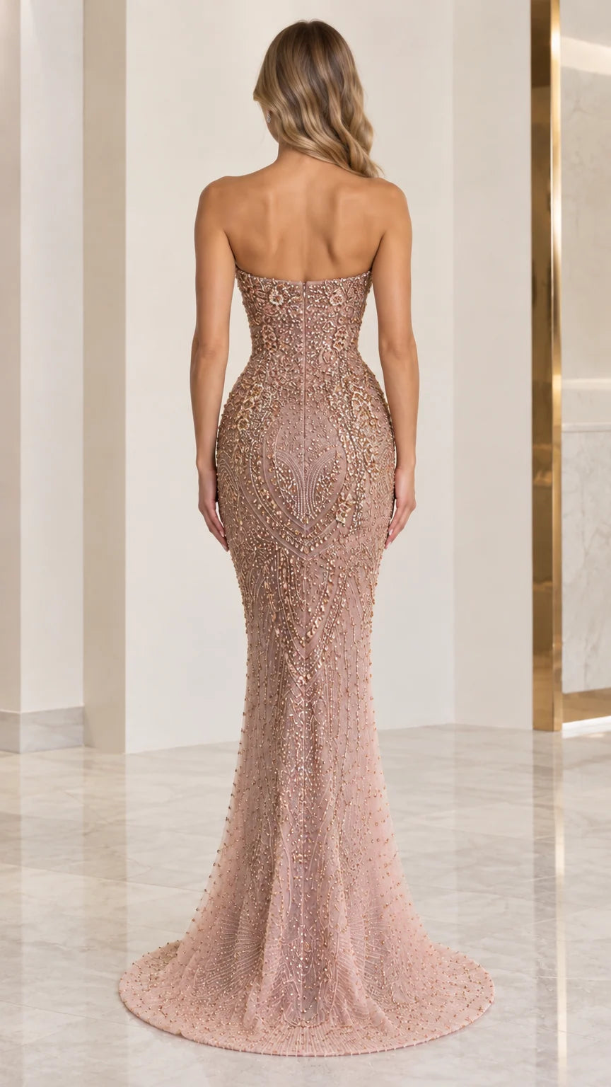Back view of dusty rose strapless mermaid gown with floor-length train