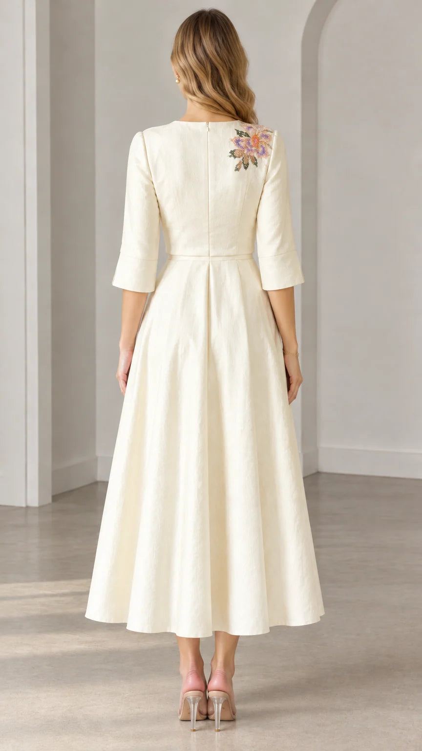 Back view of woman wearing Cream 3/4 sleeve embroidered midi dress
