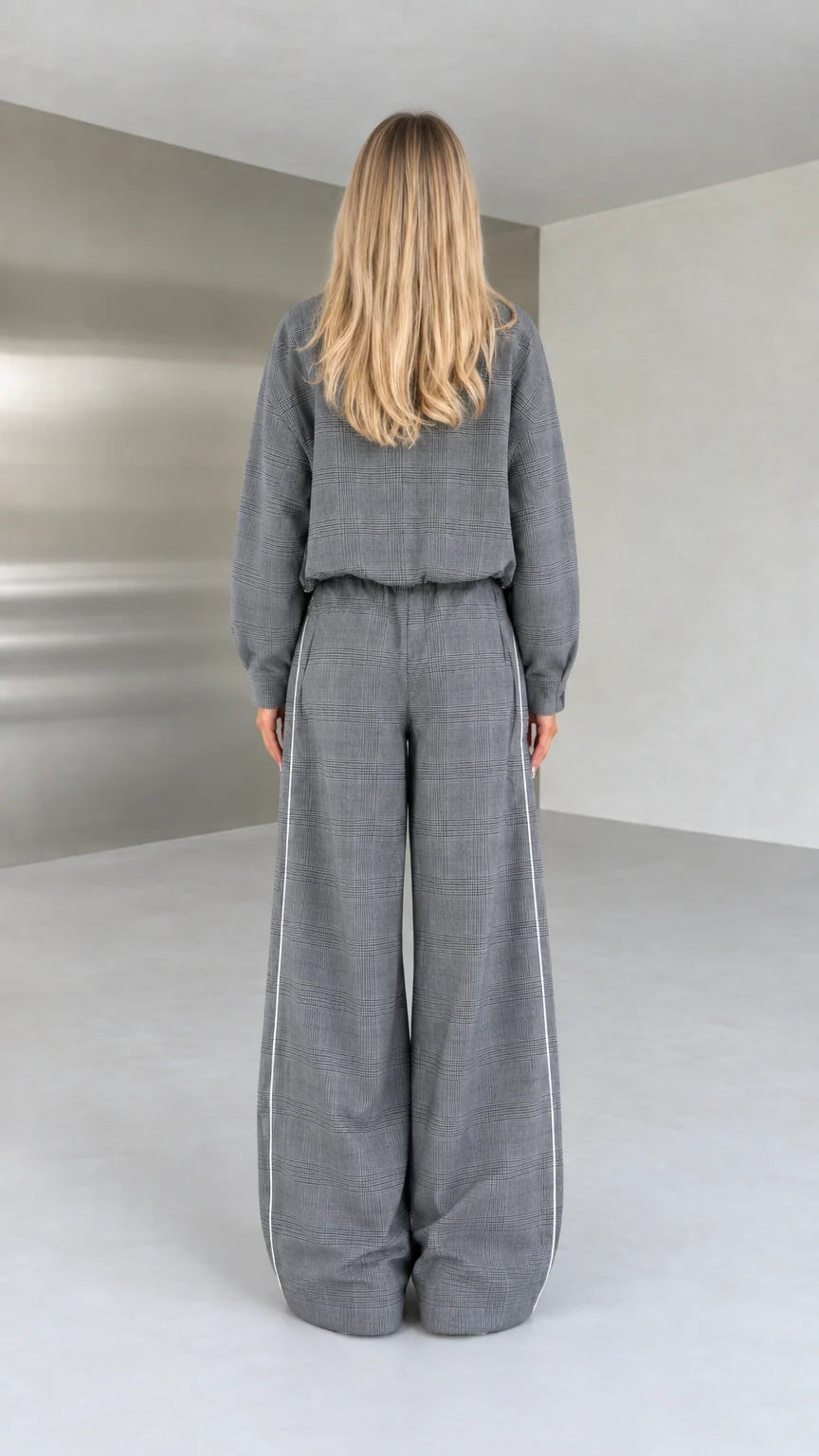 Back view of model in grey relaxed-fit two-piece loungewear set