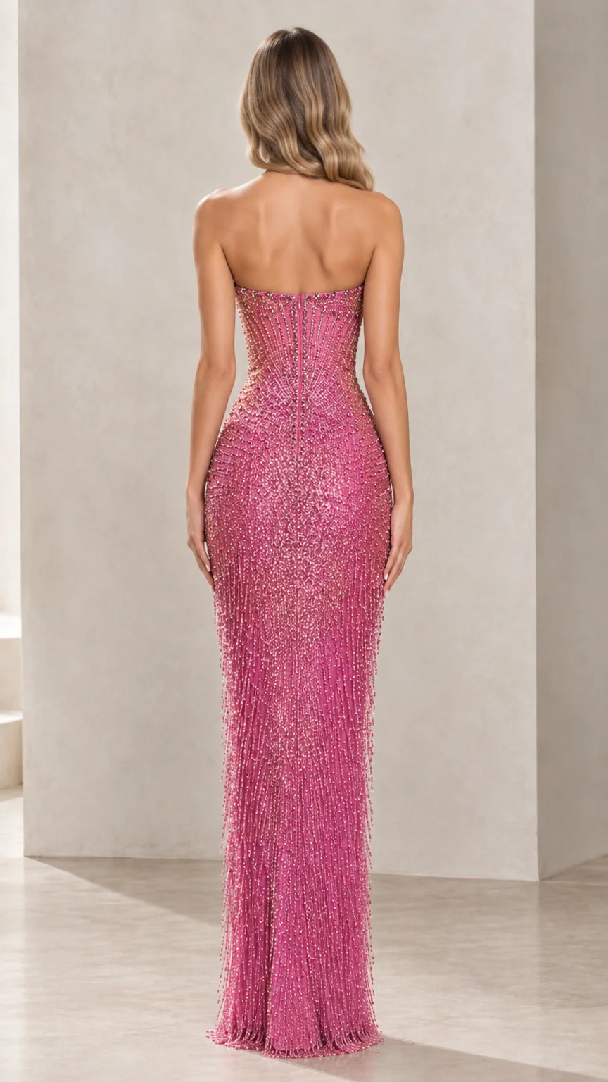 Back view of woman in fitted strapless rose pink beaded formal dress