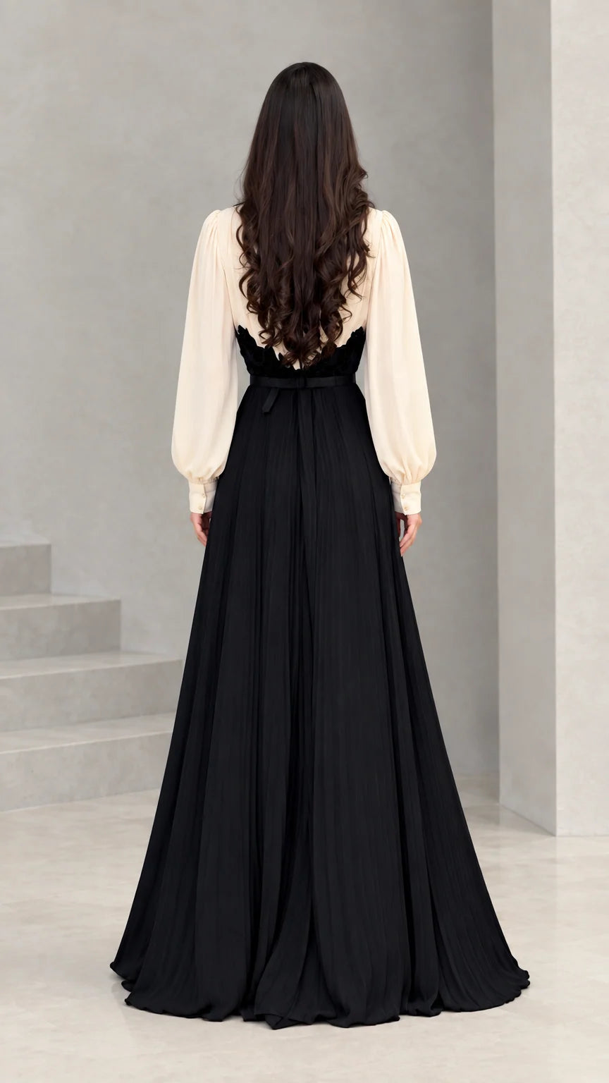 Back view of model wearing cream and black long evening maxi gown