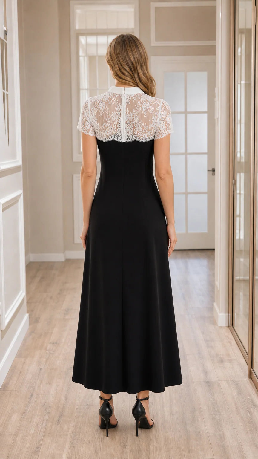 Back view of model wearing black formal maxi dress with sheer lace yoke