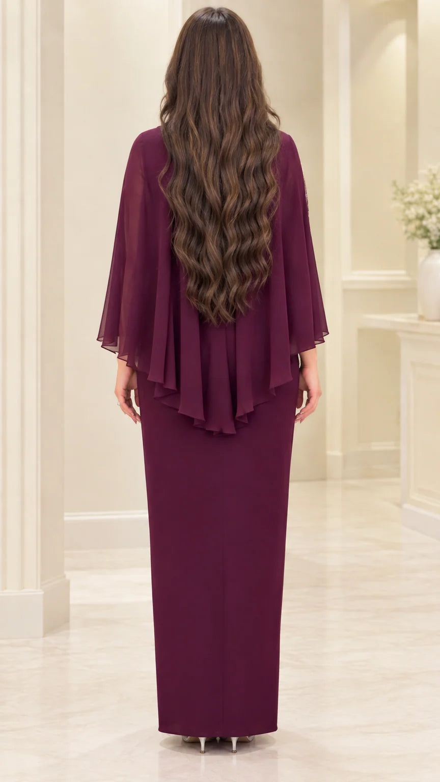 Back view of burgundy maxi dress showing tiered ruffled cape drape