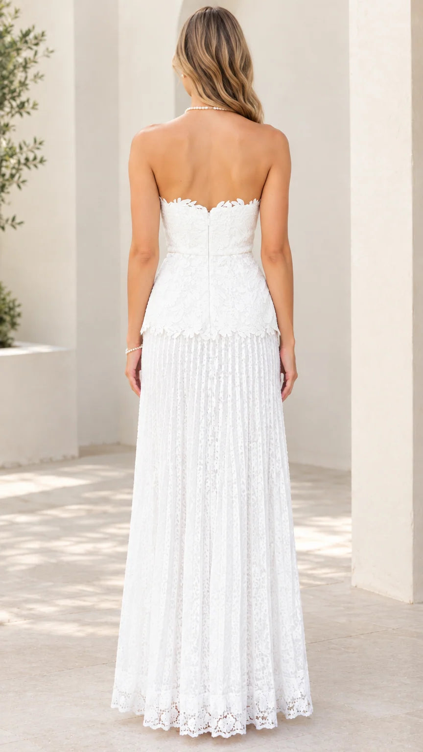 Back view of white strapless lace maxi dress showing concealed zipper closure